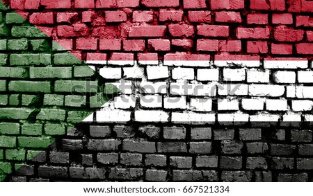 Realistic flag of Sudan on the wavy surface of fabric. This flag can be used in design