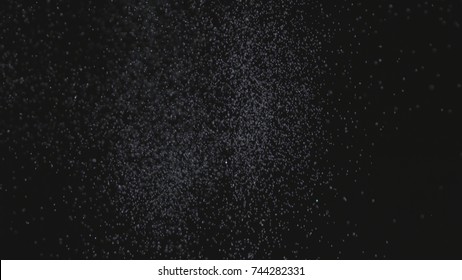 Realistic Glitter Exploding on Black Background. The perfect for visual effects, compositing, and motion graphics. Use blending mode screen .