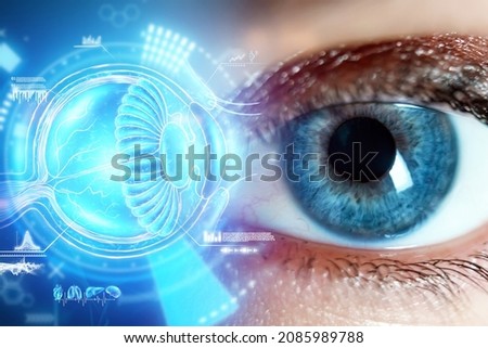 Realistic hologram of human eye and real eye close-up. Vision concept, laser eye surgery, cataract, astigmatism, modern ophthalmologist