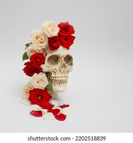 Realistic Human Skull With Red And Pink Roses. Aesthetic Love Or Halloween Concept.