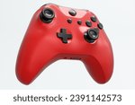 Realistic red video game joystick on white background. 3D rendering of streaming gear for cloud gaming and gamer workspace concept