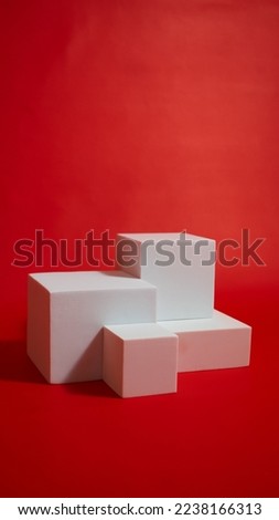 Realistic white cube pedestal podium set in red background. Set 3d podium. Minimal scene for product display presentation. Stage for showcase.