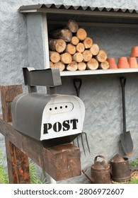 A really cool mailbox with a predominantly gray color scheme.