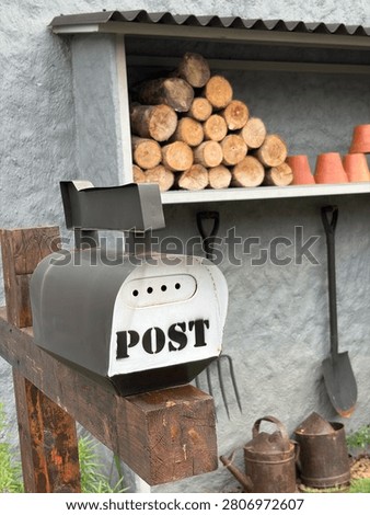 A really cool mailbox with a predominantly gray color scheme.