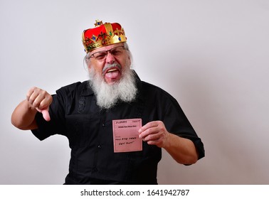 A Really Fierce And Sadistic Employer Fires A Hapless Employee. 
Example Of Corporate Greed.
 
Mature Jerk With A Golden Crown And Black Guayabera Shirt And Long White Beard.
