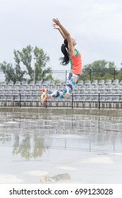 Really Tall Jump Of A Strong Athlete Girl