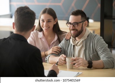 Realtor, bank worker, insurance broker or financial advisor consulting smiling millennial couple, happy clients customers planning mortgage investment, real estate rent purchase, taking loan concept