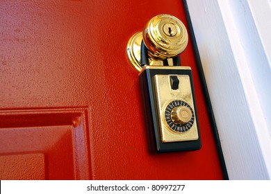 Realtor Combination Lock Box Safety Key Holder On Doorknob Of A House For Sale Entrance Door For A Real Estate Resale Transaction