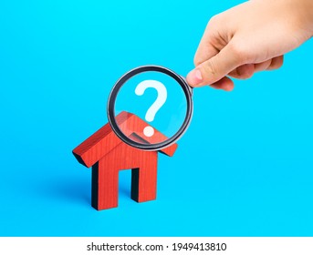 Realtor examines houses through a magnifying glass. Real estate market review. Quality of housing and availability of infrastructure. Verification of declared compliance. Price, location, legality - Shutterstock ID 1949413810