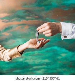 Realtor handing woman set of keys. Hands close up. reliable real estate agent giving keys. To give, offer, demonstrate, hand over the keys to the house or apartment. buying or renting real estate - Shutterstock ID 2154557461