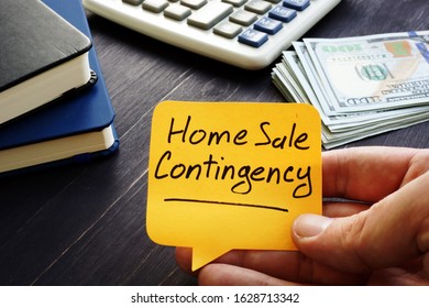 Realtor holds home sale contingency memo sign. - Shutterstock ID 1628713342