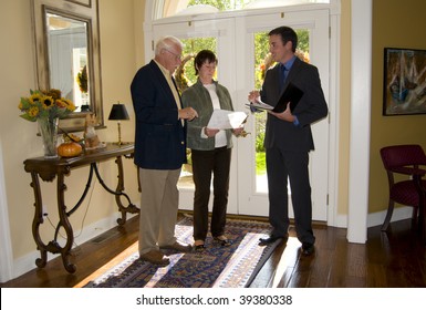 Realtor Showing A Home To A Senior Couple