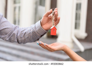 Realtor Standing Outside Modern House