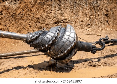 Reamer tool during Pullback Horizontal Directional Drilling (HDD), machine for Installing underground pipe along a prescribed bore path from the soil surface.Construction of Oil and gas Pipeline.