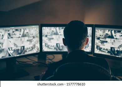 Rear Back Behind View Of His He Professional Expert Supervising Remote Panel Using Safety System Technology Equipment Night Shift Company Safety Support At Workplace Workstation