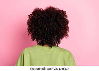 Rear back behind view portrait of attractive wavy-haired girl modern haircut isolated over pink pastel color background