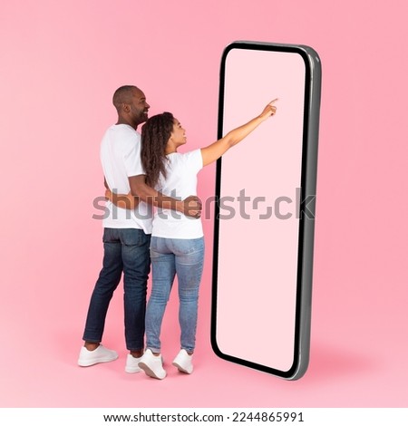 Similar – Image, Stock Photo Unrecognizable black woman touching wet ground with hand