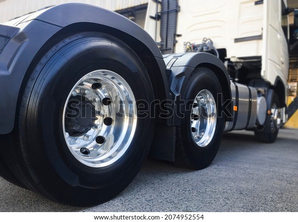 Rear of a Big Semi Truck Wheels Tires. Rubber.\
New Tyres with Chrome\
Wheels.