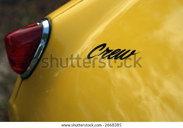 Rear brake light detail on British sports car with\
crew decal