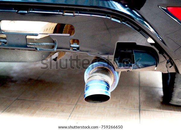 rear bumper of a car\
with exhaust pipe