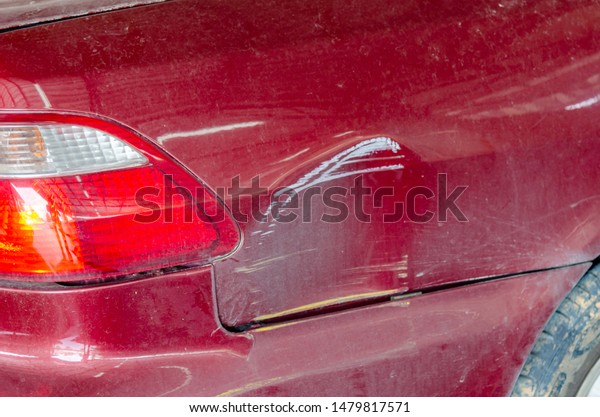 Rear bumper and\
tail lights red car\
accident.