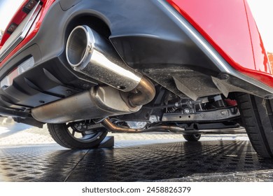 Rear car exhaust pipe and suspension. - Powered by Shutterstock