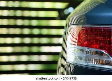 Rear Car Light against a neon multicolored backgroung