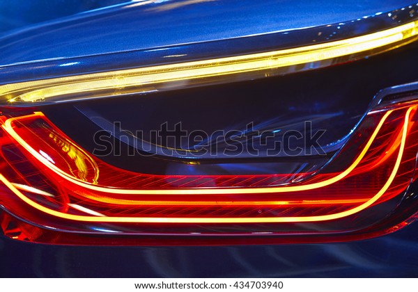 Rear car light detail in blue red tone. Vehicle part.\
Horizontal 