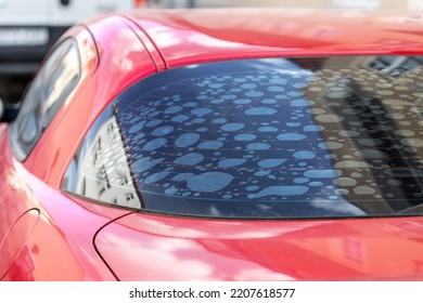 Rear Car Window With Old Adhesive Defective Dark Sunproof Tint Film In Air Bubbles. Mistake Wrong Badly Installation Tinting Vehicle Service Maintenance