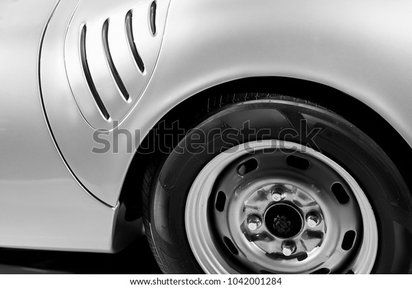 Rear fender of luxury vintage car. Old car\
classic design. Black and white\
colors