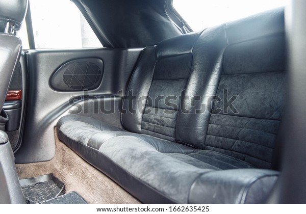 rear leather seats of a coupe convertible car.\
luxury car interior.