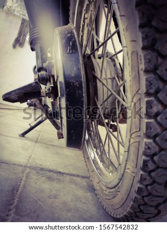 Similar – Image, Stock Photo Wheel and exhaust pipe of motorcycle on road