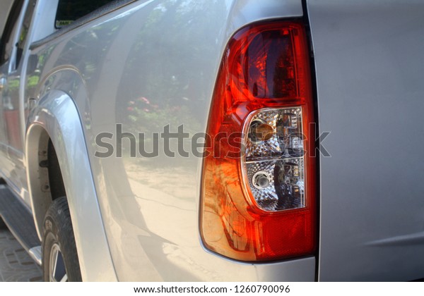 Rear\
light of the pickup  car, Tail light of pickup\
car.