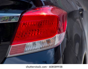 Rear lights red car and has a technology switch