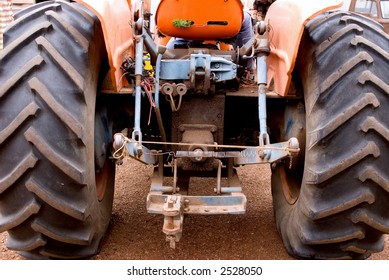 Rear Of Old Orange Tractor On Farm