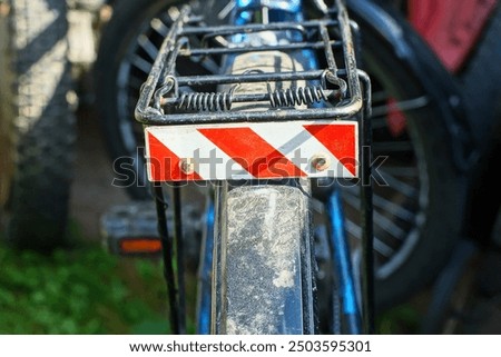 Similar – Image, Stock Photo Red bicycle luggage rack and rear light