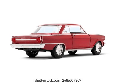 Rear and partial left side view of a red colored musscle model toy car photographed on a white background.