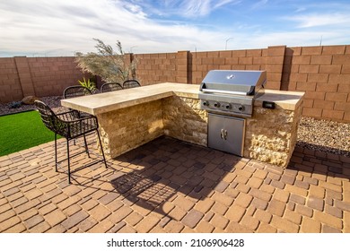 Rear Patio BBQ Station And Counter With Wicker Stools - Shutterstock ID 2106906428