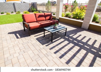 Rear Patio With Pavers, Coffee Table And Couch With Cushions