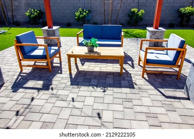 Rear Pavers Patio With Couch, Table And Two chairs - Shutterstock ID 2129222105