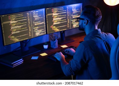 Rear photo of smart skilled introvert tester write typing operating data security evening house dark room - Shutterstock ID 2087017462
