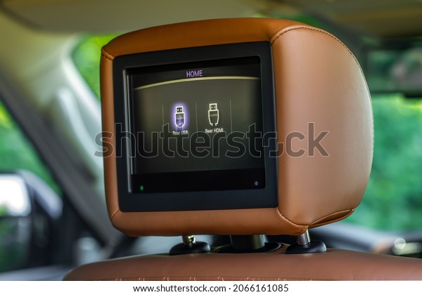 Rear seat screen. TV for passenger inside a\
modern car. Modern car DVD\
palyer.
