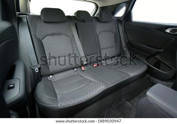 Rear seats\
covered with fabric in a luxury\
car