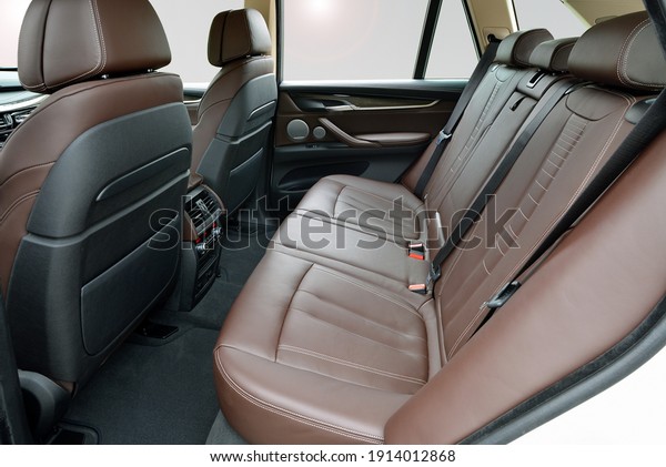 Rear seats\
covered with fabric in a luxury\
SUV