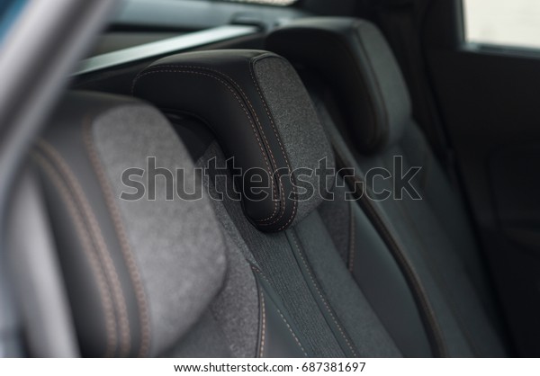 Rear seats head rest in the\
car.