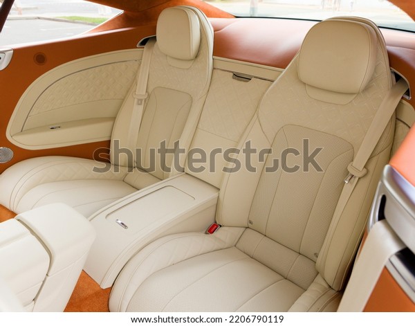 rear seats and light and red leather of a\
stylish modern car\
interior