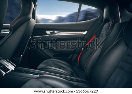 Rear seats of modern luxury car. Back seats row at the supercar