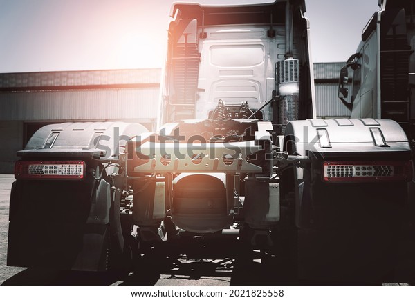 Rear of Semi Truck a Parking at The\
Warehouse. Industry Road Freight Truck. Tractor Automotive.\
Logistic and Cargo Transport\
Concept.	\
