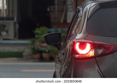 Rear side of car turn on light brake with light signal. Prepare for turn left on the asphalt. Environment in the city. - Shutterstock ID 2033850848