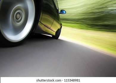 rear side view of a sport car in blurred motion